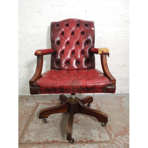 377 - Two items, one red leather Chesterfield style swivel office desk chair - approx. 99cm high x 60cm wi... 