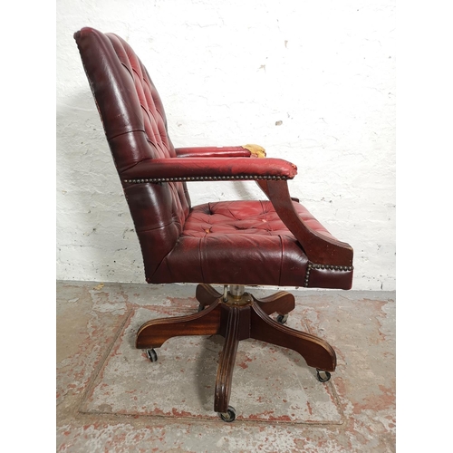 377 - Two items, one red leather Chesterfield style swivel office desk chair - approx. 99cm high x 60cm wi... 