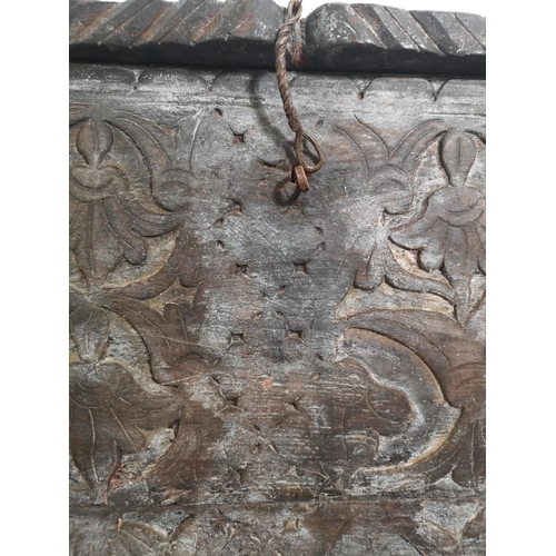 383 - An antique carved oak coffer - approx. 83cm high x 128cm wide x 40cm deep