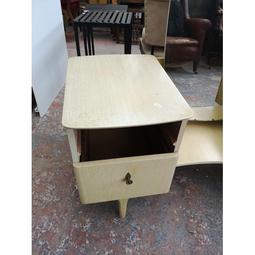 385 - A mid 20th century limed oak dressing table - approx. 145cm high x 130cm wide x 50cm deep