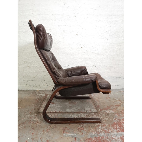 389 - A bentwood and brown leatherette armchair and matching stool