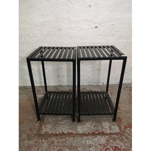 395 - A pair of modern black metal two tier side tables - approx. 65cm high x 36cm square