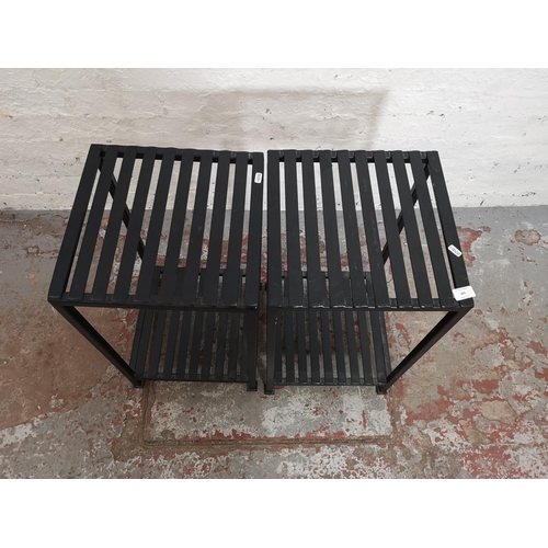 395 - A pair of modern black metal two tier side tables - approx. 65cm high x 36cm square