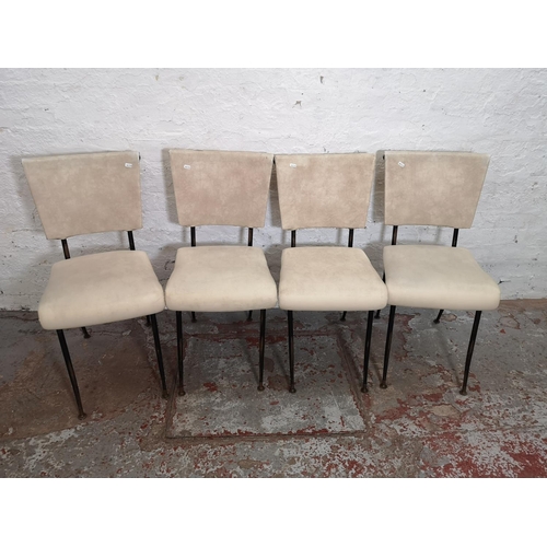 396 - A set of four white vinyl and black tubular metal dining chairs