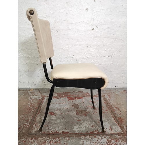 396 - A set of four white vinyl and black tubular metal dining chairs