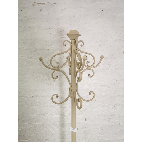 399 - A cream painted metal coat stand - approx. 180cm high