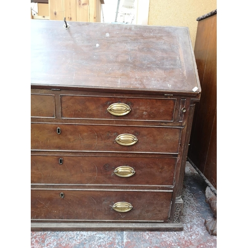 402 - A 19th century mahogany bureau with multiple secret drawers, two short drawers, three long drawers a... 