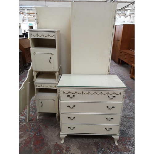 404 - A French style white and gold painted seven piece bedroom suite comprising dressing table, two doubl... 