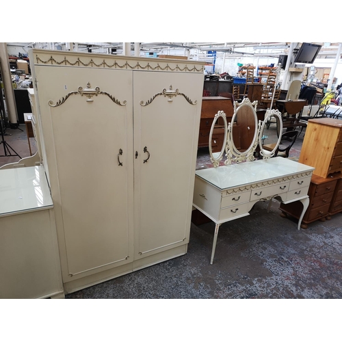 404 - A French style white and gold painted seven piece bedroom suite comprising dressing table, two doubl... 