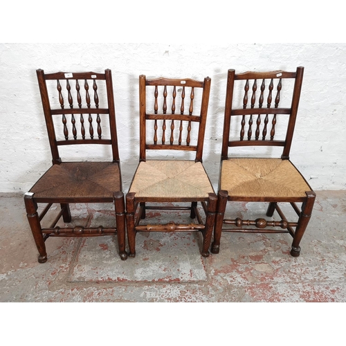 407 - Three 19th century elm and rush seated Lancashire chairs