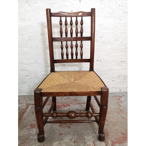 407 - Three 19th century elm and rush seated Lancashire chairs