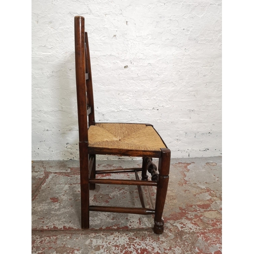 407 - Three 19th century elm and rush seated Lancashire chairs