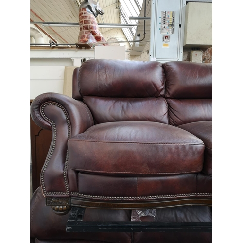 413 - A modern brown leatherette two piece lounge suite comprising three seater sofa and two seater sofa