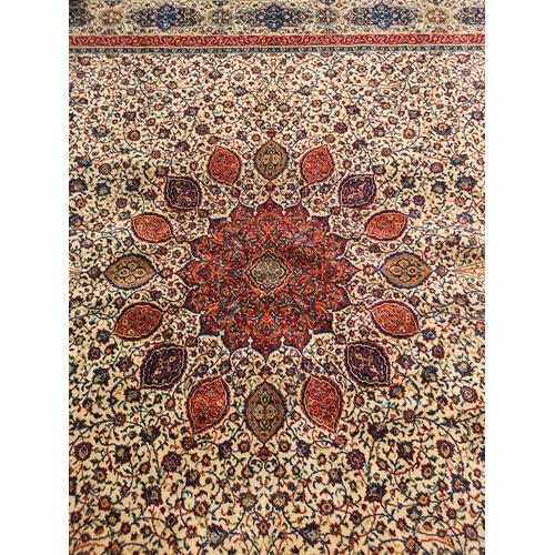 414 - A large floral patterned rug - approx. 365cm x 275cm