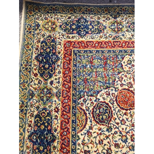 414 - A large floral patterned rug - approx. 365cm x 275cm