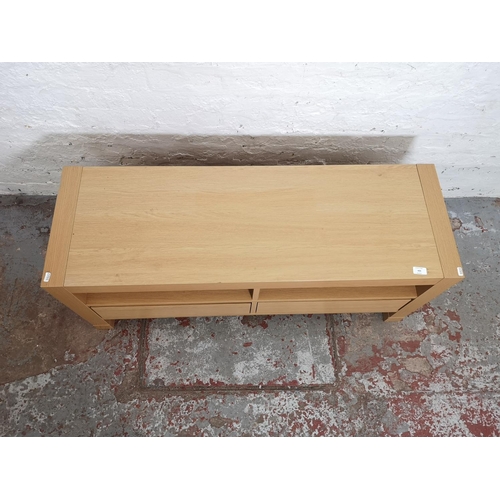 420 - A modern oak effect tv stand with two drawers - approx. 50cm high x 117cm wide x 39cm deep