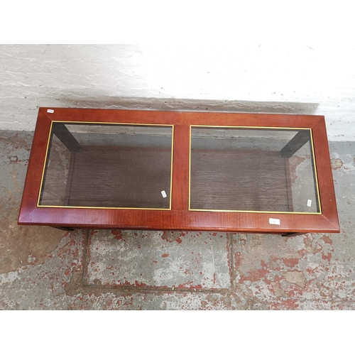 421 - A mahogany rectangular two tier coffee table with two glass inserts - approx. 43cm high x 49cm wide ... 