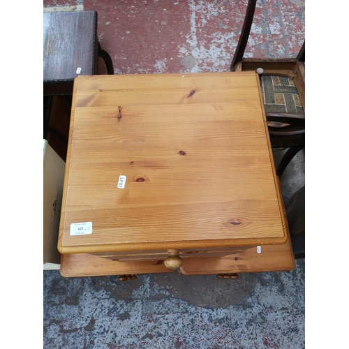 423 - Three modern pine bedside chests of three drawers