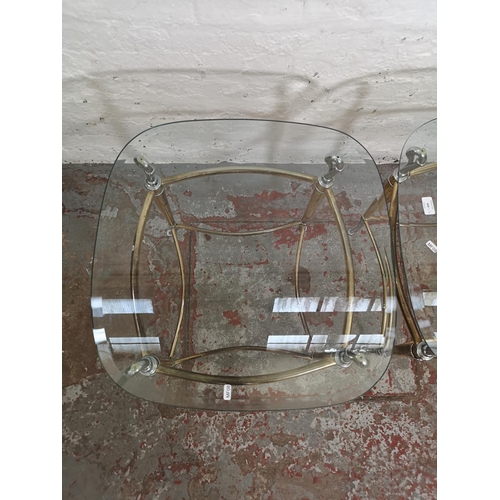 424 - A pair of brass and chrome plated side tables, both having bevelled glass tops and swan design - app... 