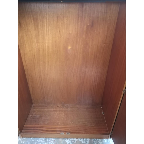 428 - Two Austinsuite teak double wardrobes - approx. 171cm high x 91cm wide x 57cm deep