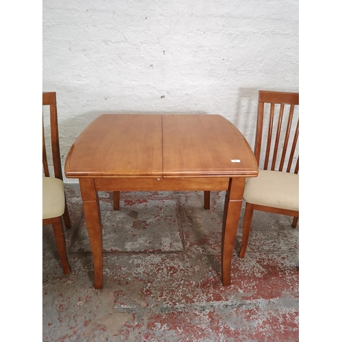 435 - A modern beech extending dining table and four matching chairs - approx. 75cm high x 80cm wide x 90c... 