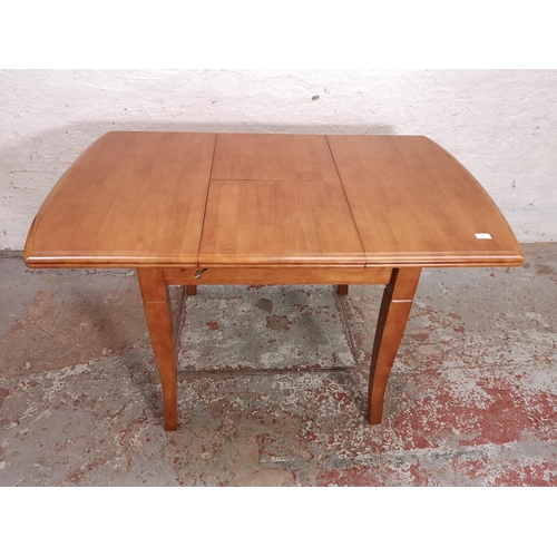 435 - A modern beech extending dining table and four matching chairs - approx. 75cm high x 80cm wide x 90c... 