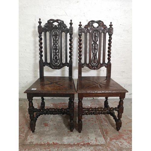 437 - Two 19th century heavily carved oak dining chairs with barley twist design