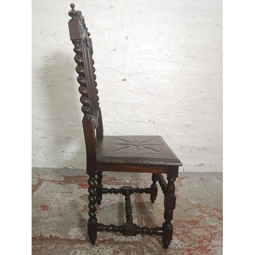 437 - Two 19th century heavily carved oak dining chairs with barley twist design