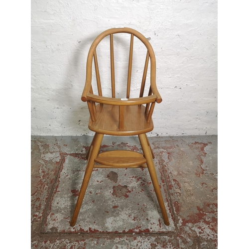 454 - An Ercol style beech child's highchair - approx. 90cm high