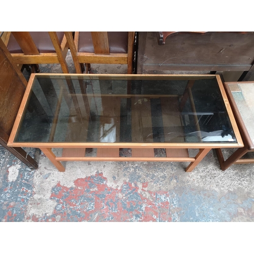 460 - Two mid 20th century rectangular coffee tables, one teak and tiled top and one beech with smoked gla... 