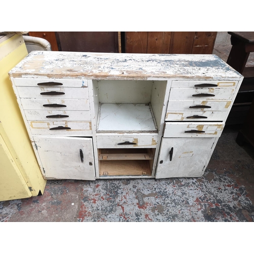 464 - A mid 20th century white painted school cupboard - approx. 81cm high x 110cm wide x 34cm deep