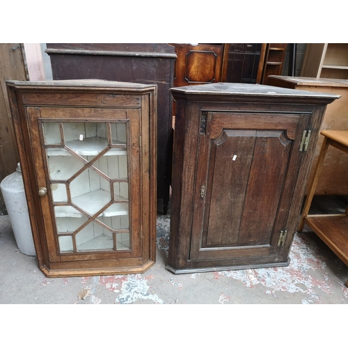 470 - Two George III oak wall mountable corner cabinets