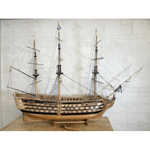 148 - A large scratch built wooden three mast model of The Victory ship on plinth - approx. 150cm high x 2... 