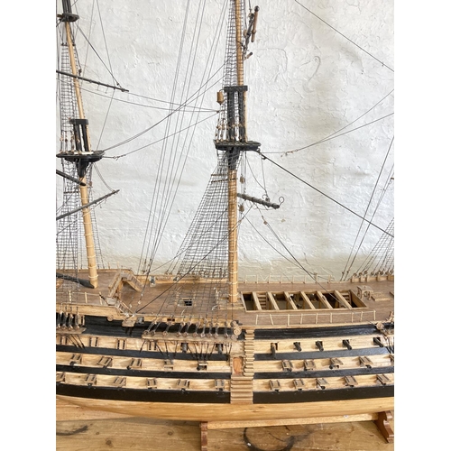 148 - A large scratch built wooden three mast model of The Victory ship on plinth - approx. 150cm high x 2... 