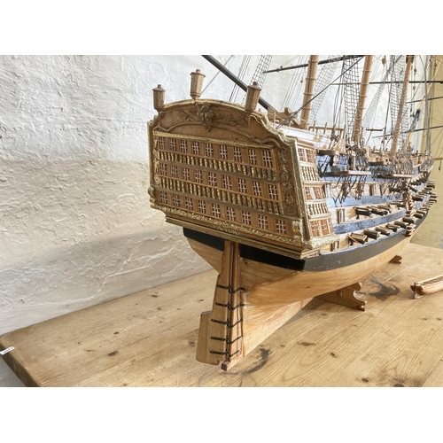 148 - A large scratch built wooden three mast model of The Victory ship on plinth - approx. 150cm high x 2... 