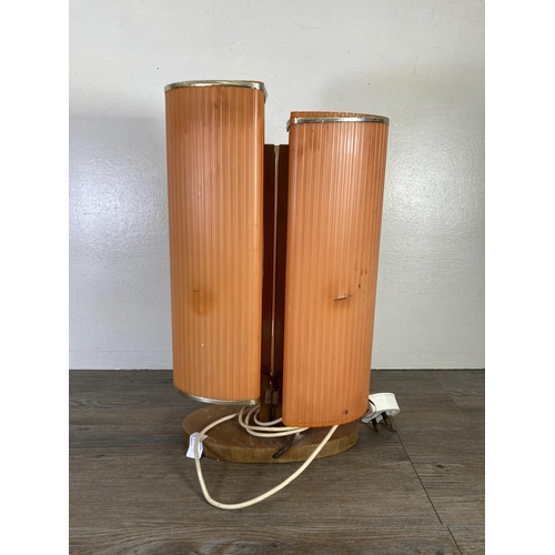 305 - A mid 20th century orange plastic and beech table lamp - approx. 46cm high