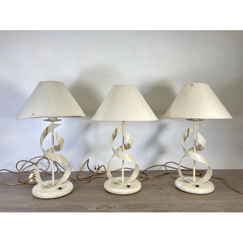 308 - Three modern painted metal table lamps with ribbon design - approx. 50cm high including shade