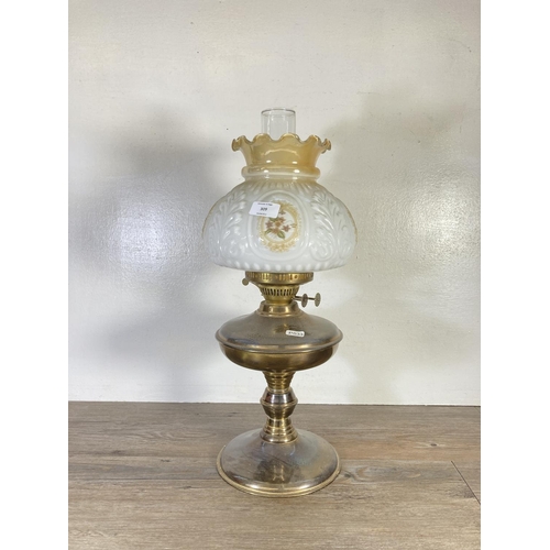 309 - A brass oil lamp with milk glass shade and glass funnel - approx. 54cm high including funnel