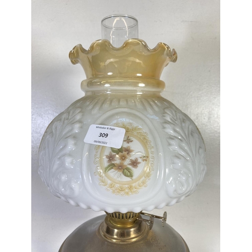 309 - A brass oil lamp with milk glass shade and glass funnel - approx. 54cm high including funnel