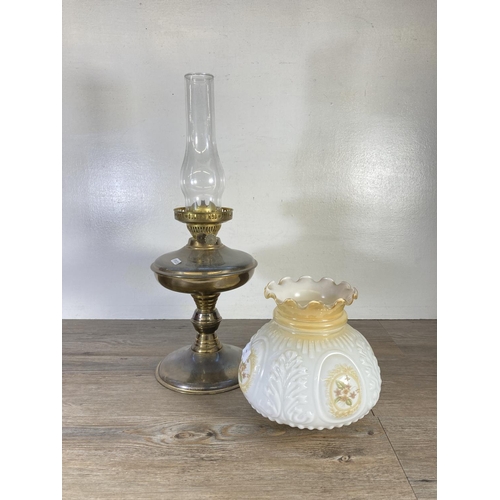 309 - A brass oil lamp with milk glass shade and glass funnel - approx. 54cm high including funnel