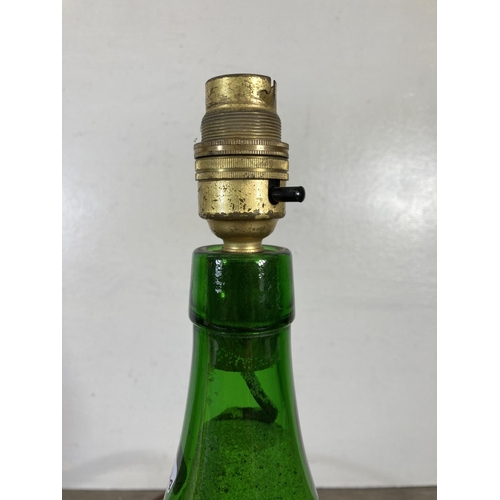 313 - A vintage Bulmer's green glass cider bottle converted table lamp - approx. 35cm high including bulb ... 