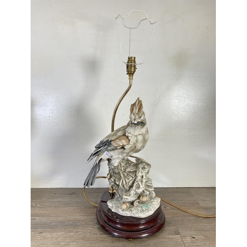 314 - Two 1984 Capodimonte figural table lamps with bird design - approx. 52cm high including bulb holder