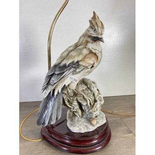 314 - Two 1984 Capodimonte figural table lamps with bird design - approx. 52cm high including bulb holder