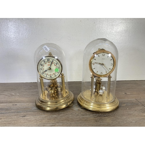 318 - Two German brass anniversary clocks with plastic domes, one being Kundo - largest approx. 23cm high