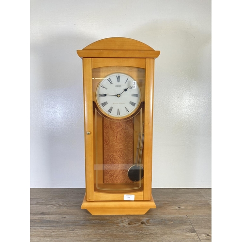 319 - A Seiko Westminster Whittington wall clock with pendulum - approx. 63cm high x 27cm wide