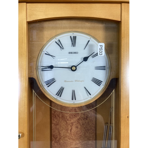 319 - A Seiko Westminster Whittington wall clock with pendulum - approx. 63cm high x 27cm wide