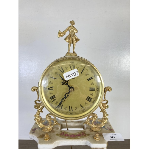 321 - An Alfa gilt metal and porcelain quartz mantel clock with pendulum - approx. 48cm high