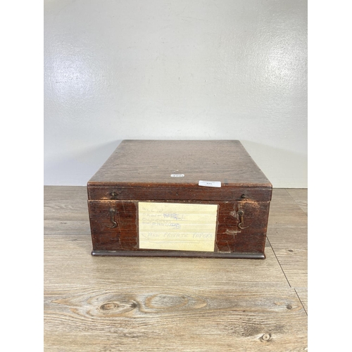 325 - An early 20th century oak lidded box - approx. 14cm high x 33cm wide x 34cm deep