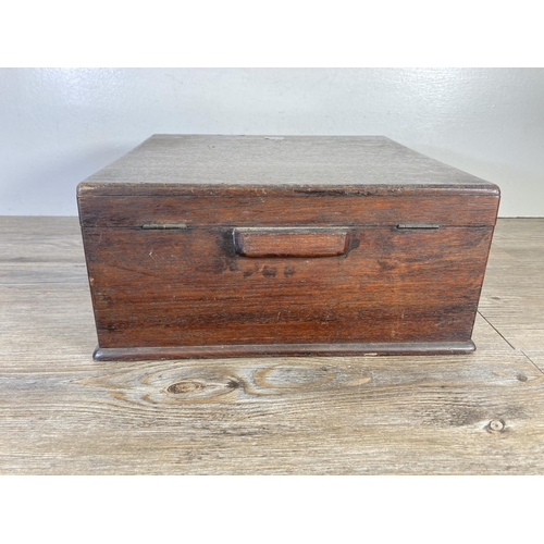 325 - An early 20th century oak lidded box - approx. 14cm high x 33cm wide x 34cm deep