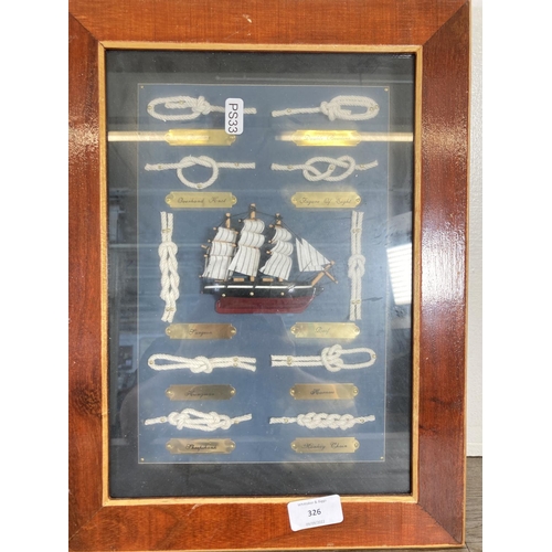 326 - Two framed items, one nautical knot board - approx. 40cm high x 30cm wide and one print of a fisherm... 